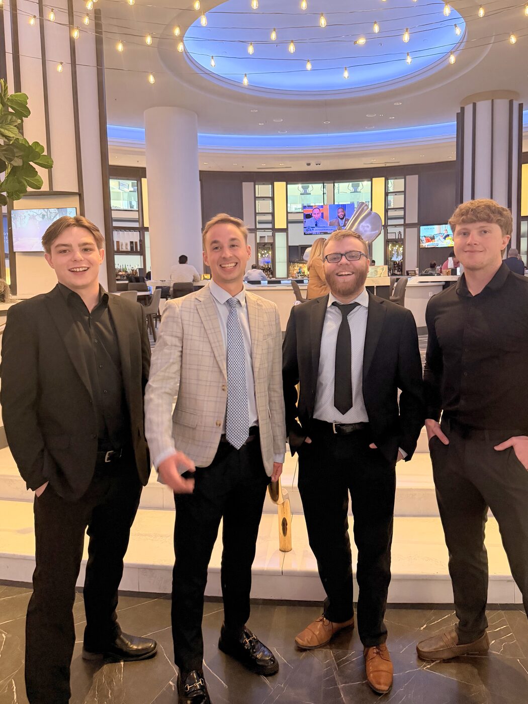 The Risin Enterprises team together at a company event